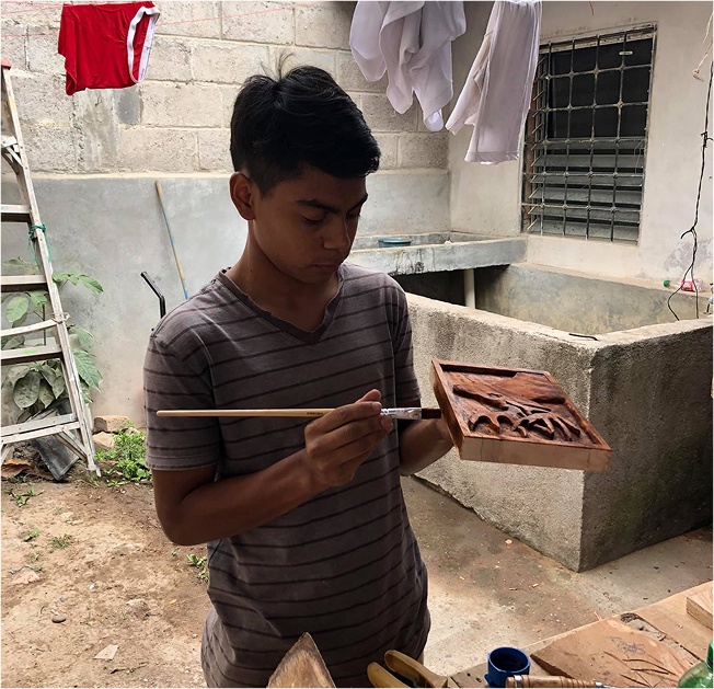 boy holding tool